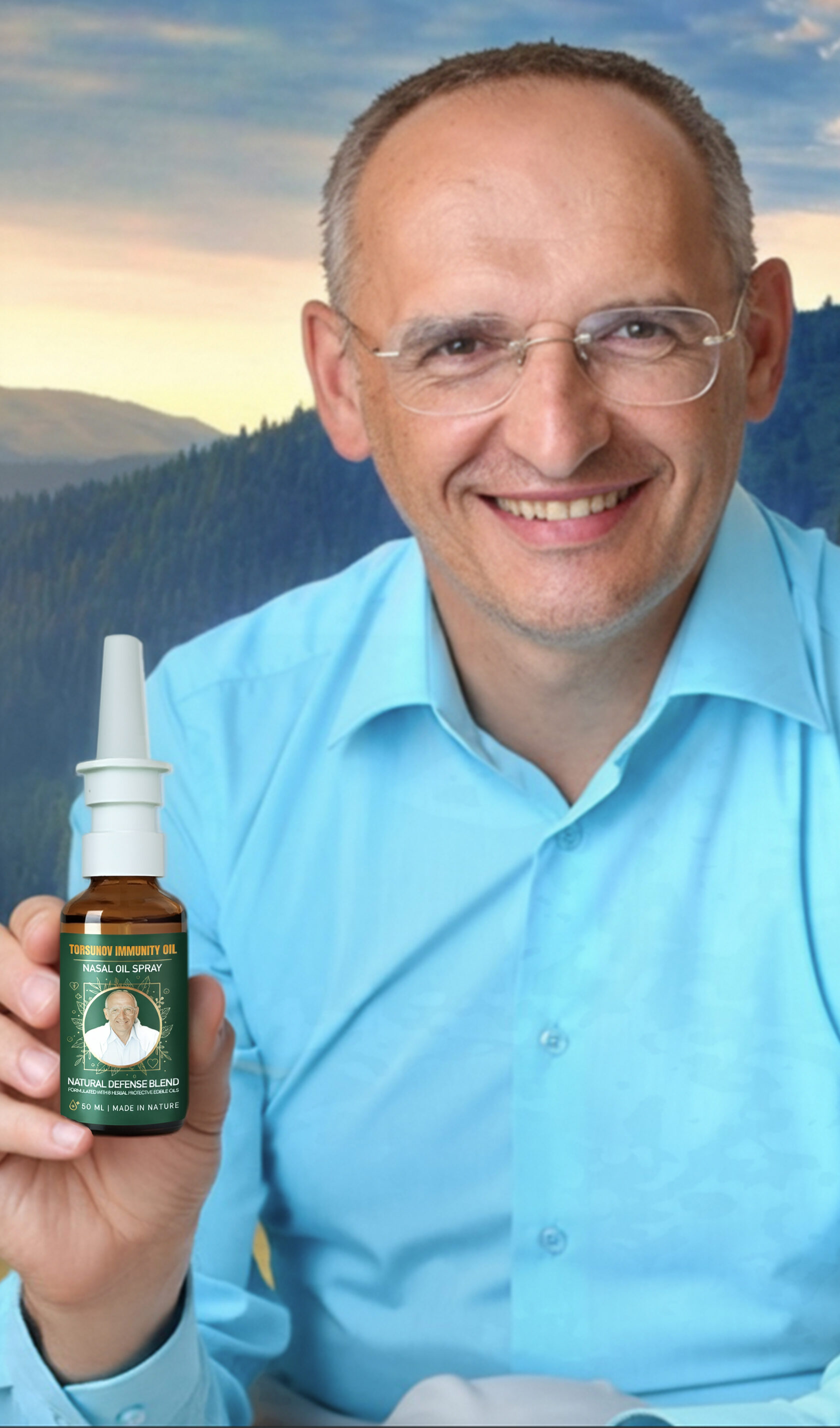 О.Г. Торсунов тримає флакон Torsunov Immunity Oil